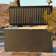 Black cold plunge with open lid and a wooden mat lifestyle image