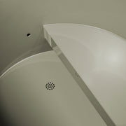 Corner of a shower enclosure with a drain cover