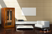 Modern living room with wooden sauna, white sofa, and coffee table.