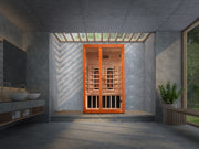 Infrared sauna in a modern room with concrete walls and large windows.