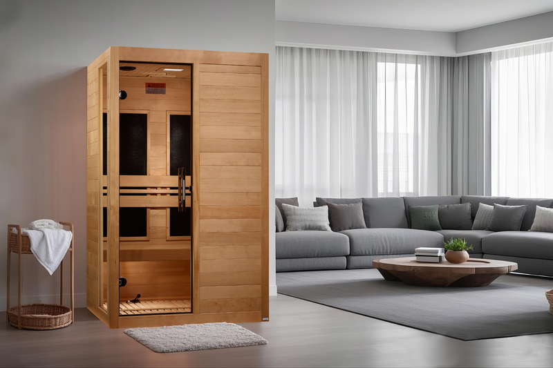 Wooden sauna in a modern living room with a gray sectional sofa and coffee table.