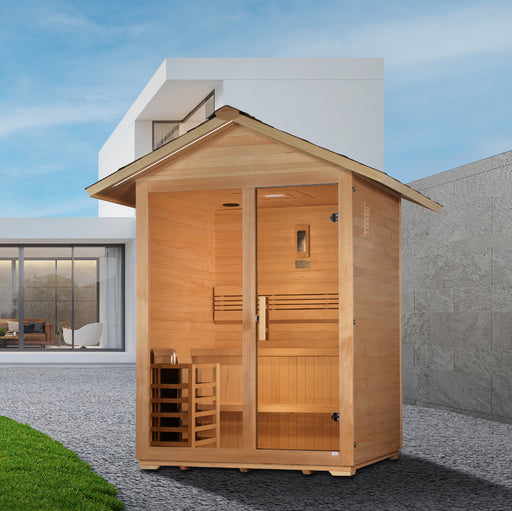 Wooden outdoor sauna with modern house in the background
