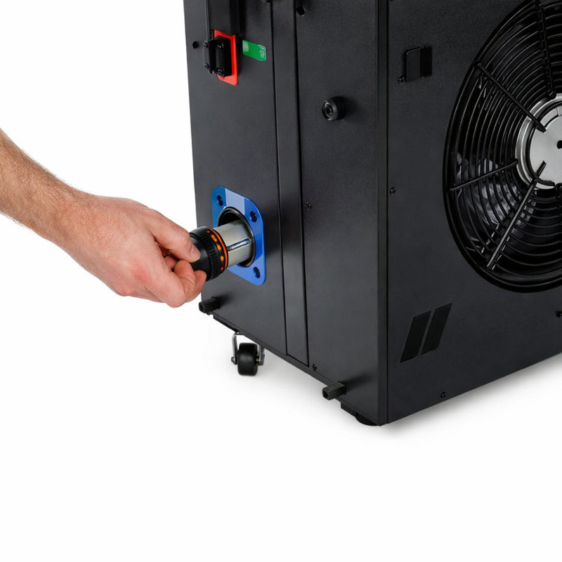 Hand opening the cover of a black chiller unit to reveal a filter.