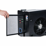 Hand opening the cover of a black chiller unit to reveal a pump.