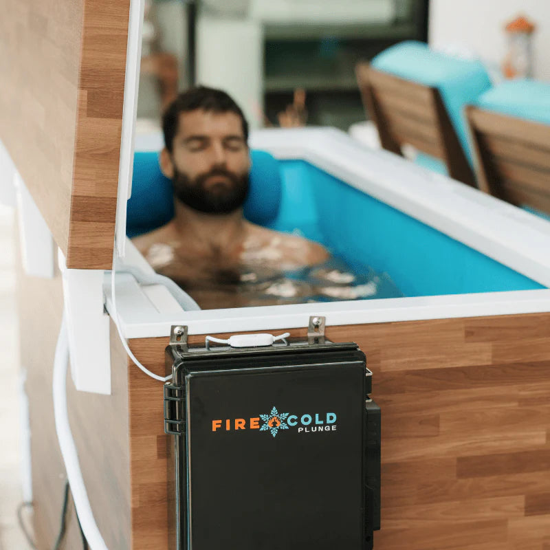 Person in a cold water cold plunge tub.